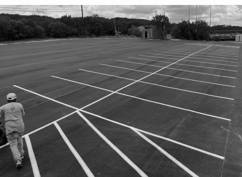 Empty parking lot with clearly painted spaces