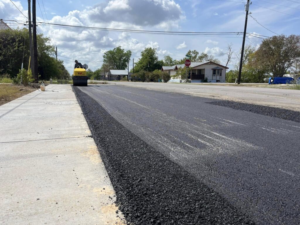 New asphalt covers a residential street