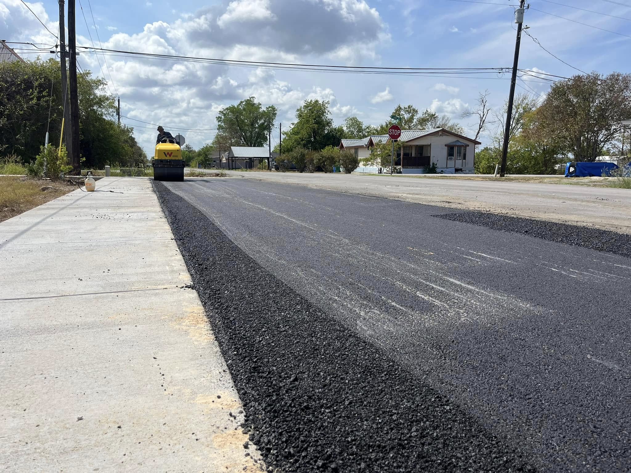 New asphalt covers a residential street